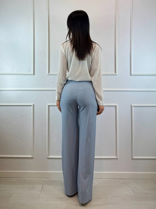 Pantalone a zampa con tasche americane