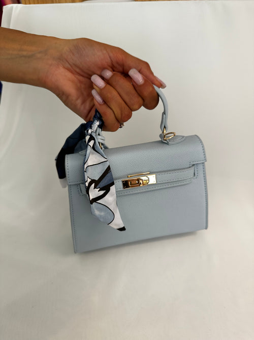 Borsa piccola fibbia e foulard ecopelle