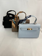 Borsa piccola fibbia e foulard ecopelle